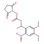 2,5-Pyrrolidinedione, 1-[[[1-(4,5-dimethoxy-2-nitrophenyl)ethoxy]carbonyl]oxy]- (9CI)